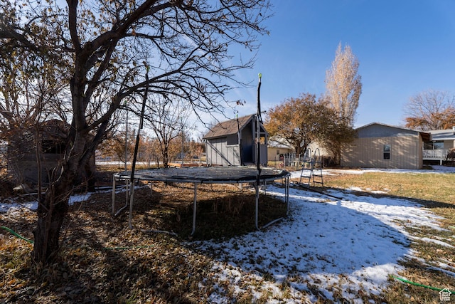1052 N 2500 W, Vernal, UT 84078 - snowy yard with a trampoline and an outdoor structure