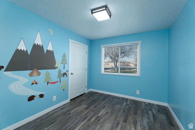 1052 N 2500 W, Vernal, UT 84078 - unfurnished bedroom with dark wood-style flooring and baseboards