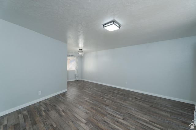 1052 N 2500 W, Vernal, UT 84078 - unfurnished room with dark wood-style flooring, baseboards, and a textured ceiling