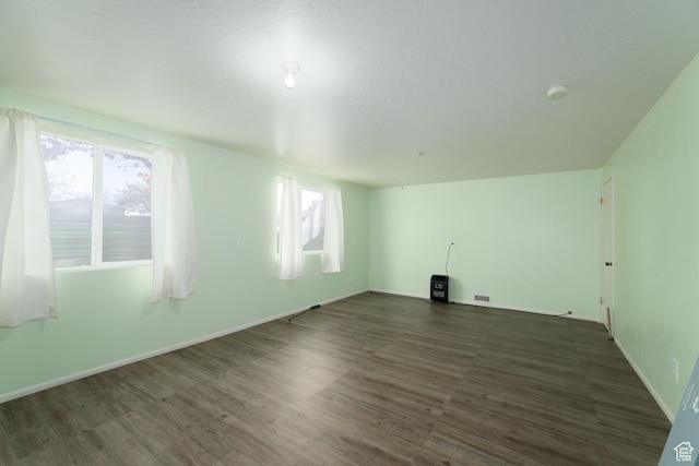1052 N 2500 W, Vernal, UT 84078 - spare room featuring wood finished floors, a smoke detector, and baseboards