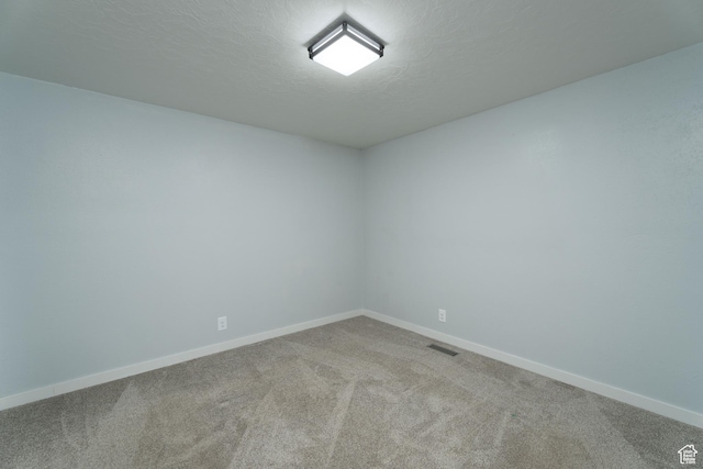 1052 N 2500 W, Vernal, UT 84078 - carpeted spare room with baseboards and a textured ceiling