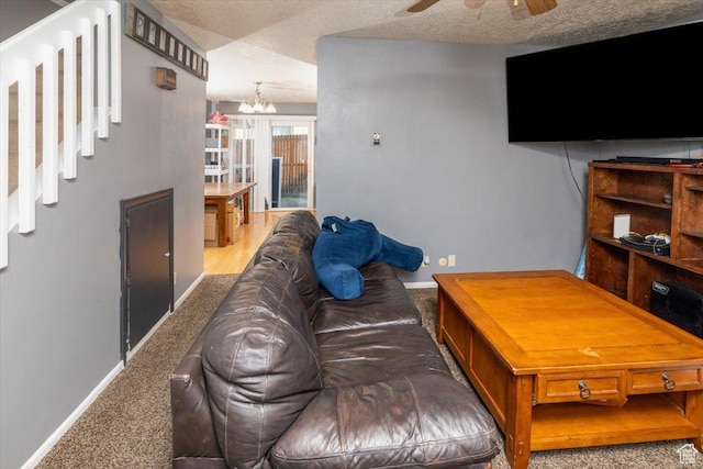 281 W 600 N Unit 4, Logan, UT 84321 - carpeted living room with ceiling fan with notable chandelier and a textured ceiling