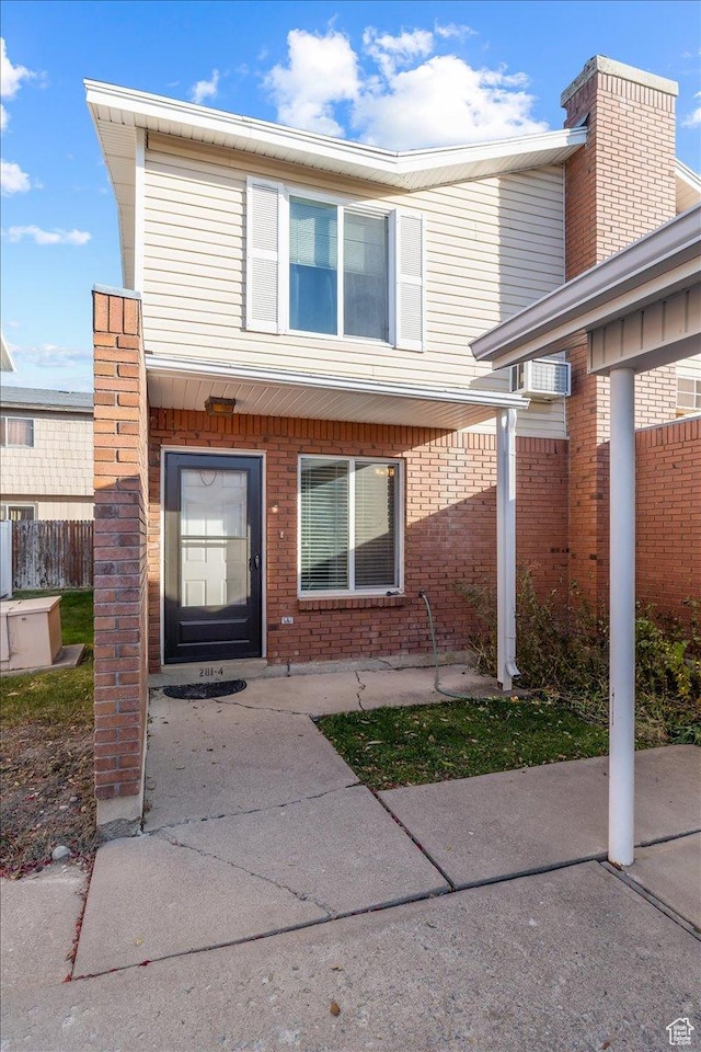 281 W 600 N Unit 4, Logan, UT 84321 - doorway to property featuring a wall mounted air conditioner