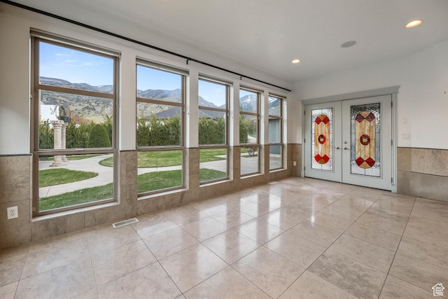 386 Edgehill Dr, Providence, UT 84332 - unfurnished room with a mountain view, visible vents, and plenty of natural light