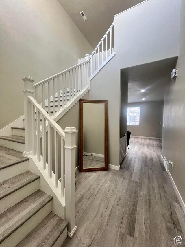 staircase featuring hardwood / wood-style floors