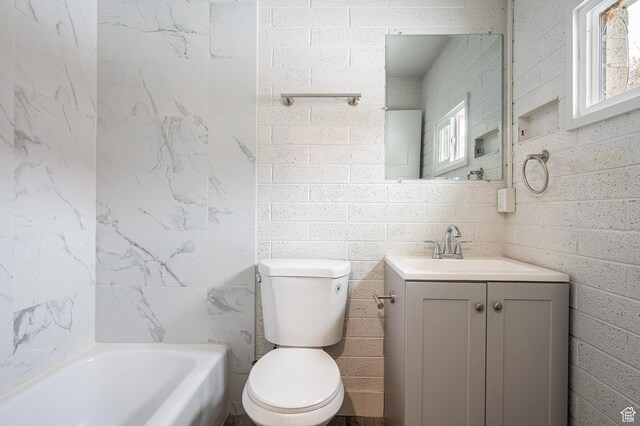 1180 S Cove View Rd, Richfield, UT 84701 - bathroom with plenty of natural light, toilet, a washtub, and vanity