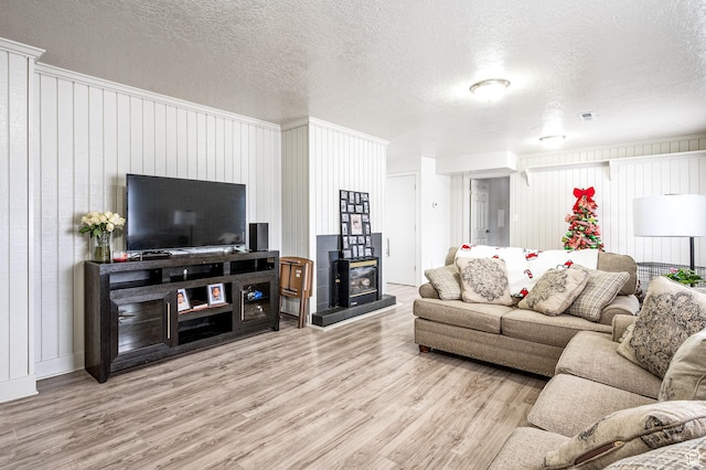 1180 S Cove View Rd, Richfield, UT 84701 - living room with light hardwood / wood-style flooring and a textured ceiling