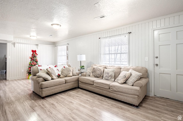 1180 S Cove View Rd, Richfield, UT 84701 - living room with a textured ceiling, hardwood / wood-style flooring, and wood walls