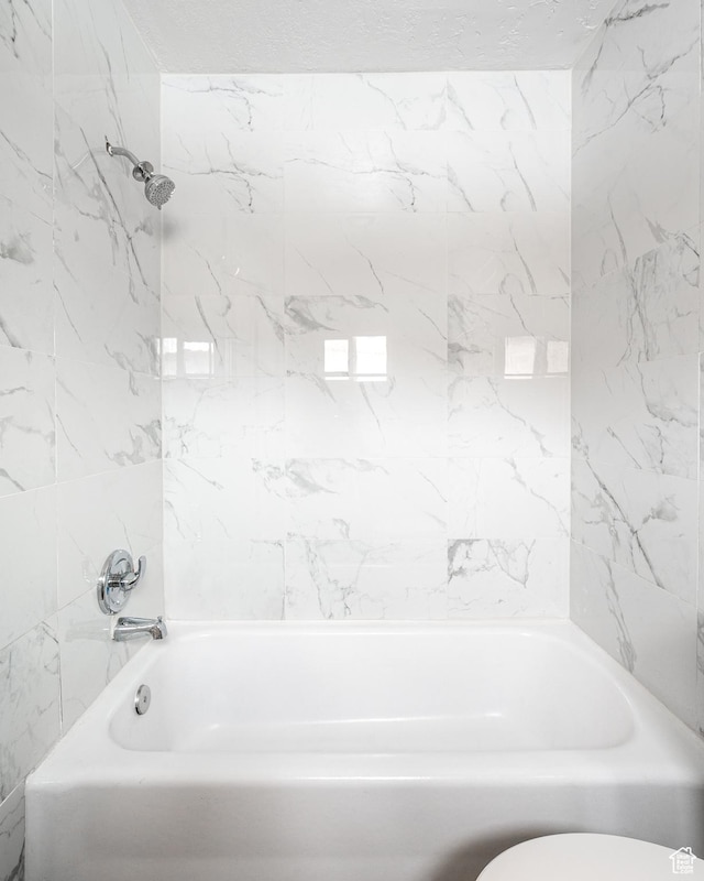 1180 S Cove View Rd, Richfield, UT 84701 - bathroom featuring tiled shower / bath combo and toilet