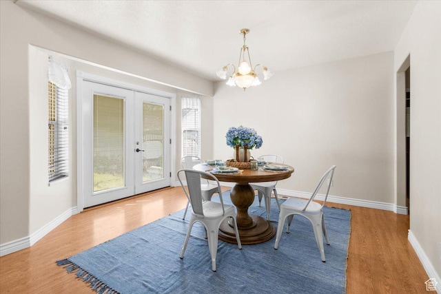 68 E 100 N, Nephi, UT 84648 - dining area with french doors, a chandelier, wood finished floors, and baseboards
