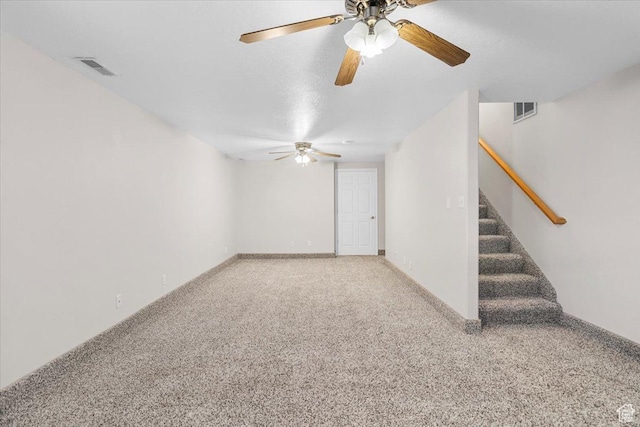 interior space featuring carpet flooring and ceiling fan