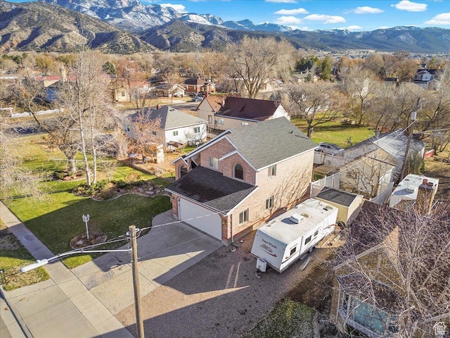 birds eye view of property featuring a mountain view