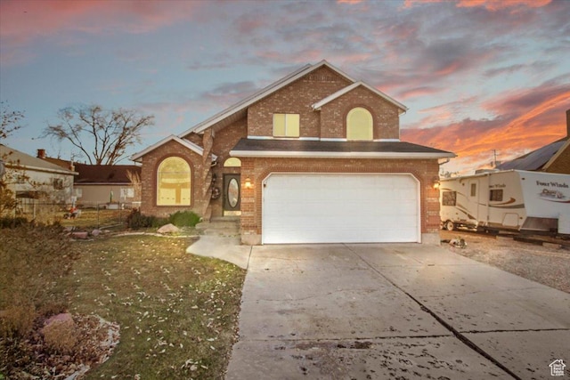 front of property with a garage