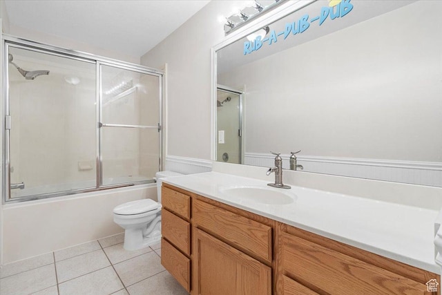 68 E 100 N, Nephi, UT 84648 - bathroom featuring vanity, tile patterned flooring, combined bath / shower with glass door, and toilet