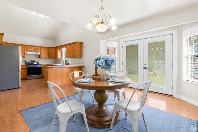 68 E 100 N, Nephi, UT 84648 - dining area with a chandelier, light wood finished floors, vaulted ceiling, and french doors