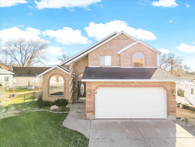 view of front facade with a front yard and a garage