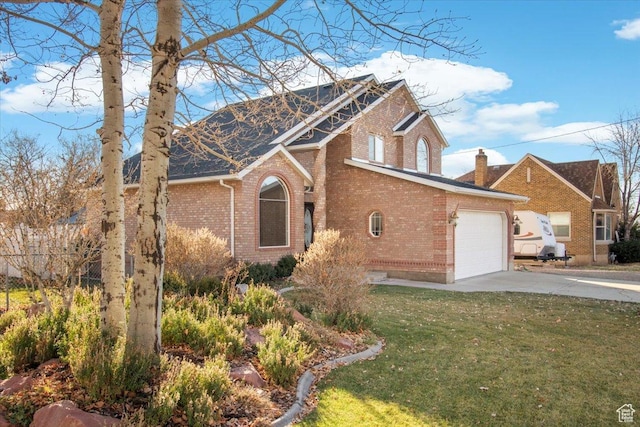 view of front of property featuring a garage and a front yard