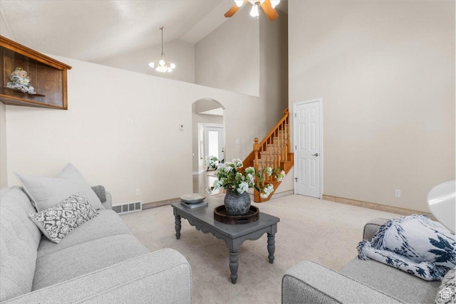 68 E 100 N, Nephi, UT 84648 - living area featuring arched walkways, light colored carpet, a ceiling fan, baseboards, and high vaulted ceiling