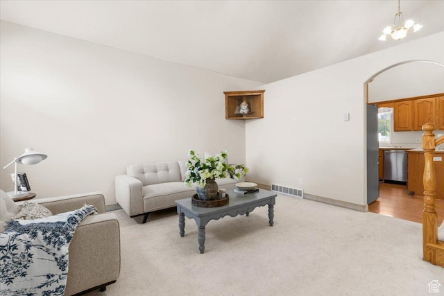 68 E 100 N, Nephi, UT 84648 - living area with a chandelier, light colored carpet, lofted ceiling, and baseboards