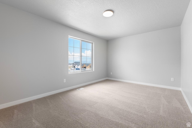 6636 W Prairie Fire Ln Unit 733, Herriman, UT 84096 - carpeted empty room with a textured ceiling