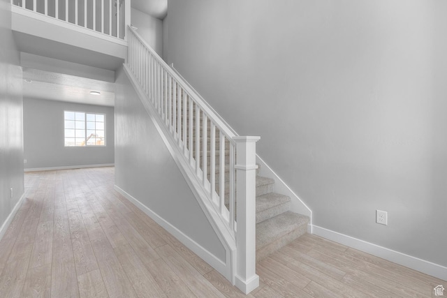 6636 W Prairie Fire Ln Unit 733, Herriman, UT 84096 - staircase with wood-type flooring