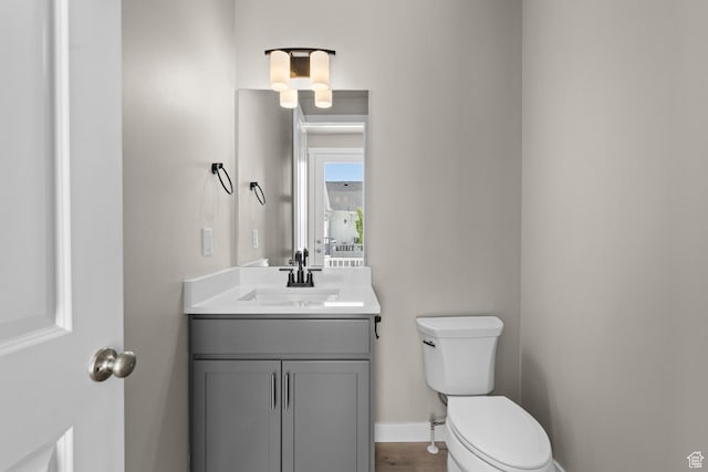 bathroom with vanity and toilet
