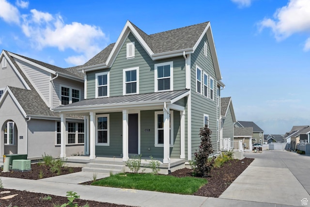 view of front of property featuring a porch and central air condition unit