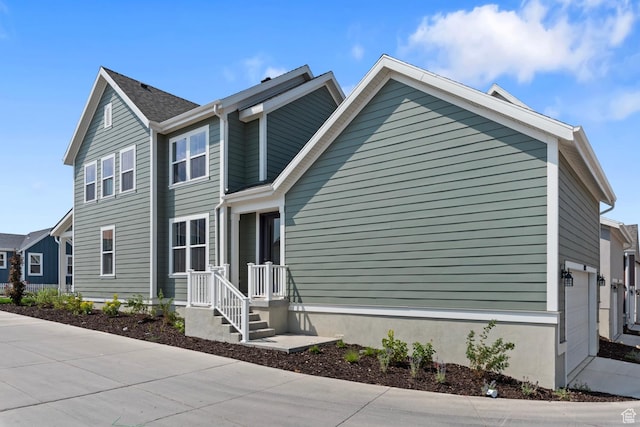 view of side of property featuring a garage