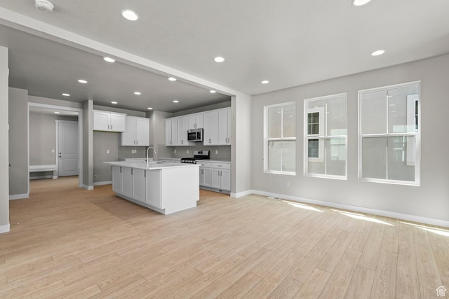 11209 S Easy Bee Rd, South Jordan, UT 84009 - kitchen with appliances with stainless steel finishes, baseboards, light countertops, white cabinets, and recessed lighting