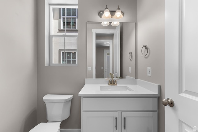 bathroom with vanity and toilet