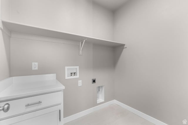 washroom with washer hookup, electric dryer hookup, and light tile patterned floors