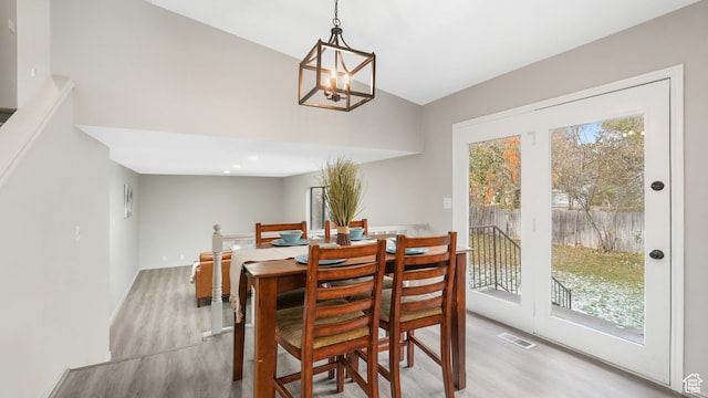 1583 E 1500 N, Logan, UT 84341 - dining space featuring a chandelier, lofted ceiling, and light wood-type flooring