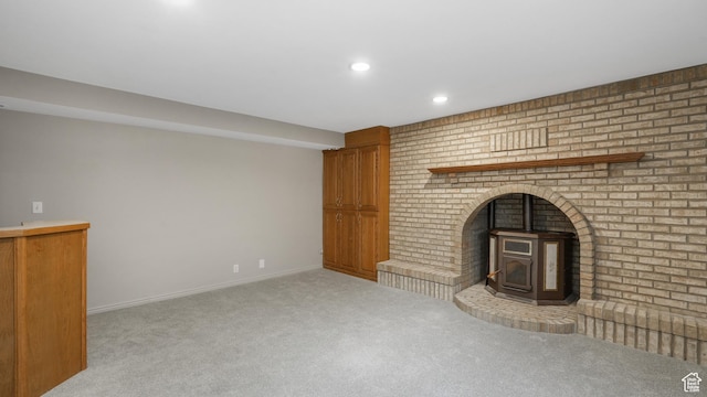 1583 E 1500 N, Logan, UT 84341 - unfurnished living room with a wood stove and light carpet