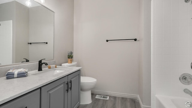 1583 E 1500 N, Logan, UT 84341 - full bathroom with hardwood / wood-style flooring, vanity, tiled shower / bath combo, and toilet