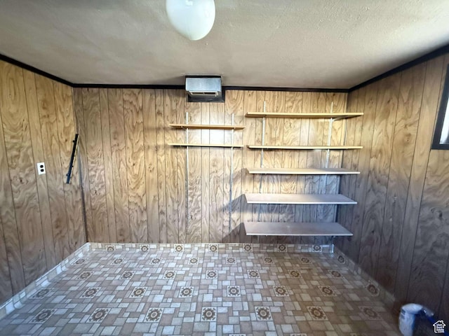 laundry room with wooden walls