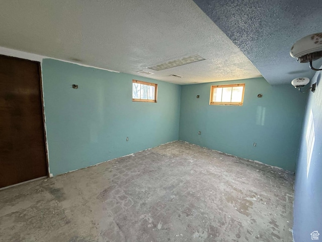 basement with a textured ceiling