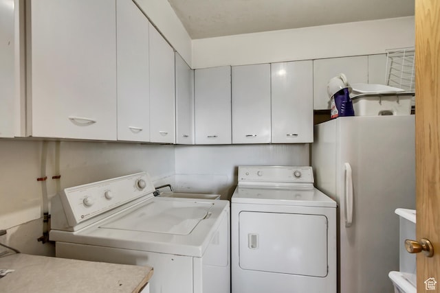 130 S 1300 E 703 &4, Salt Lake City, UT 84102 - laundry room with washer and clothes dryer and cabinets