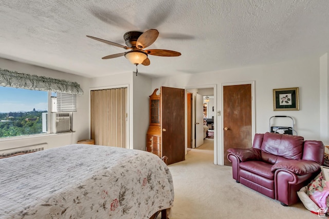 130 S 1300 E 703 &4, Salt Lake City, UT 84102 - bedroom with light carpet, a textured ceiling, ceiling fan, cooling unit, and a closet