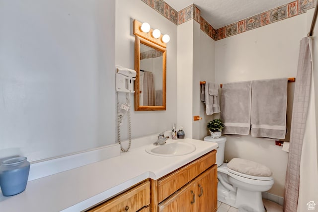 130 S 1300 E 703 &4, Salt Lake City, UT 84102 - bathroom featuring tile patterned floors, vanity, toilet, and a textured ceiling