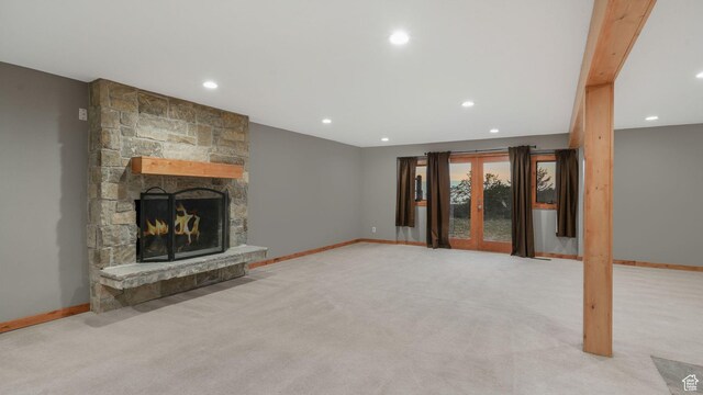 120 N 1400 E, Pleasant Grove, UT 84062 - unfurnished living room featuring a stone fireplace and light colored carpet
