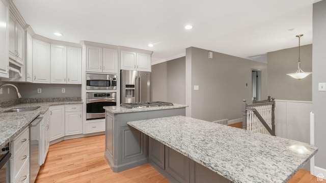 120 N 1400 E, Pleasant Grove, UT 84062 - kitchen with white cabinets, a center island, sink, and stainless steel appliances