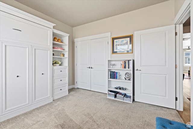 unfurnished bedroom featuring light carpet