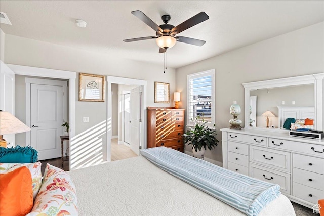 bedroom featuring light hardwood / wood-style flooring and ceiling fan