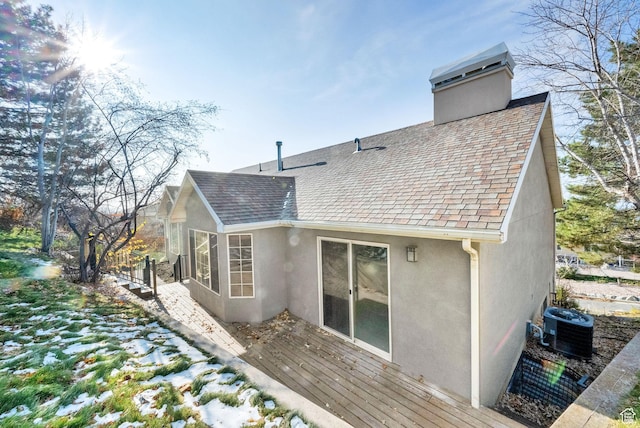 4821 S Fortuna Way, Salt Lake City, UT 84124 - rear view of property featuring stucco siding, a shingled roof, central air condition unit, and a chimney