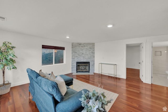 4821 S Fortuna Way, Salt Lake City, UT 84124 - living room featuring recessed lighting, a stone fireplace, baseboards, and wood finished floors
