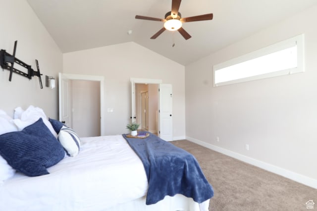 bedroom with carpet, baseboards, vaulted ceiling, and ceiling fan