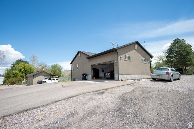 159 S 400 E, Annabella, UT 84711 - view of side of home featuring an attached garage and driveway