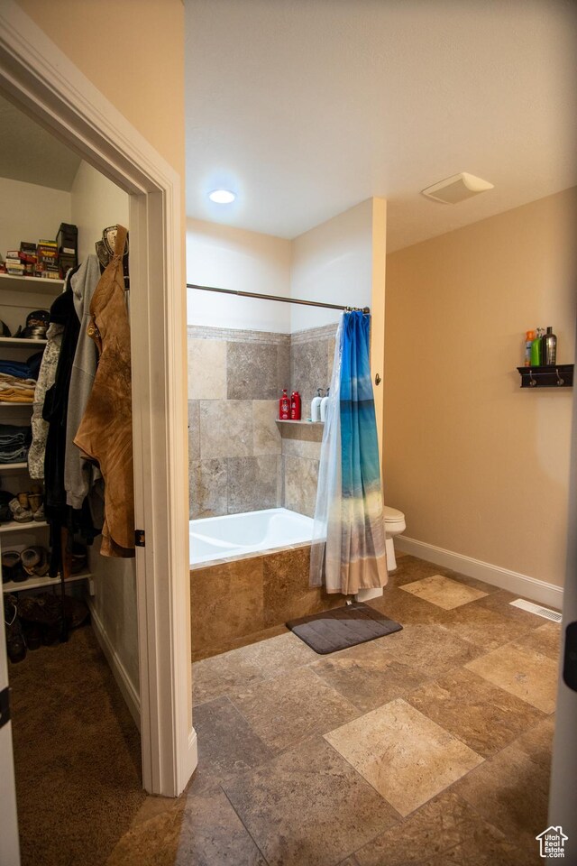 159 S 400 E, Annabella, UT 84711 - full bathroom with tiled shower / bath combo, stone finish floors, toilet, and baseboards