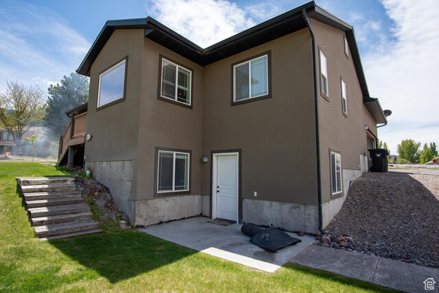 159 S 400 E, Annabella, UT 84711 - rear view of property featuring a yard, stucco siding, and stairs