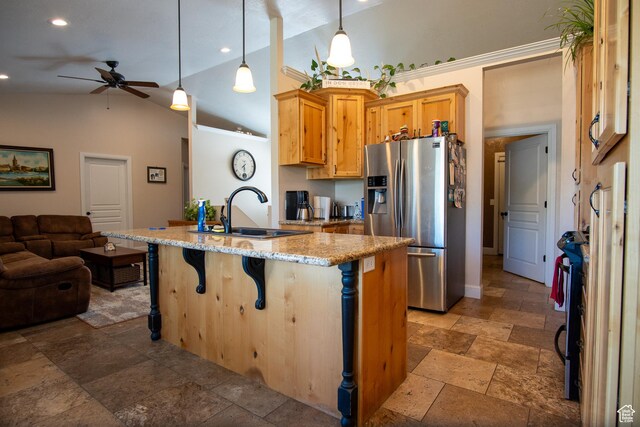 159 S 400 E, Annabella, UT 84711 - kitchen featuring stainless steel fridge, a sink, open floor plan, stone tile floors, and lofted ceiling